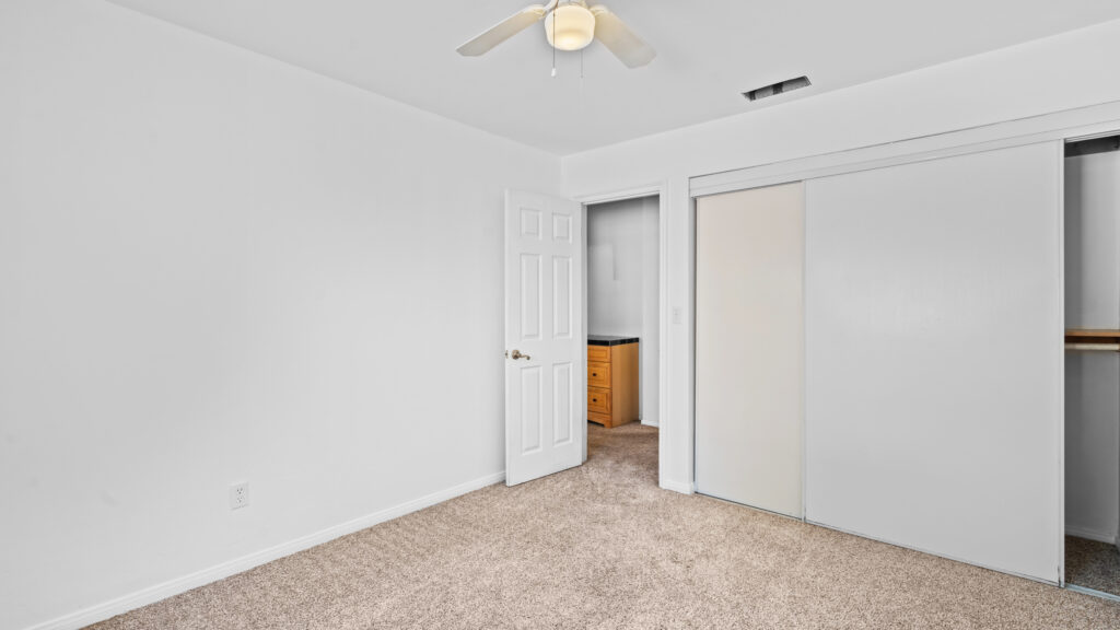 Selling a tenant-occupied home in San Diego - furnished bedroom in a rental listed for sale with tenants still living there
